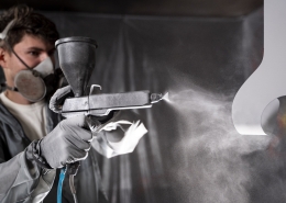 man-working-with-paint-gun-medium-shot