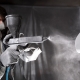 man-working-with-paint-gun-medium-shot